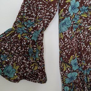 brown floral dress with pleats and bell sleeves